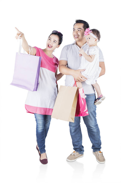Smiling family shopping together  - 写真・画像