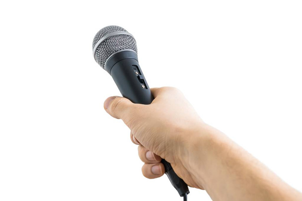 Reporter is holding microphone in hand. Isolated on white background. - Zdjęcie, obraz