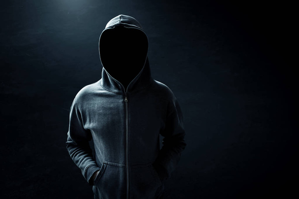 Hacker standing alone in dark room - Foto, Bild