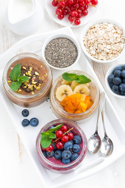assorted breakfast of chia seeds and fruits in jars  - Photo, image