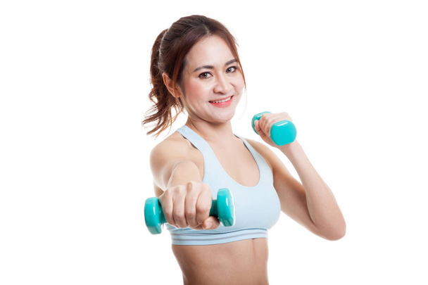 Beautiful Asian healthy girl exercise with dumbbell. - Foto, Bild