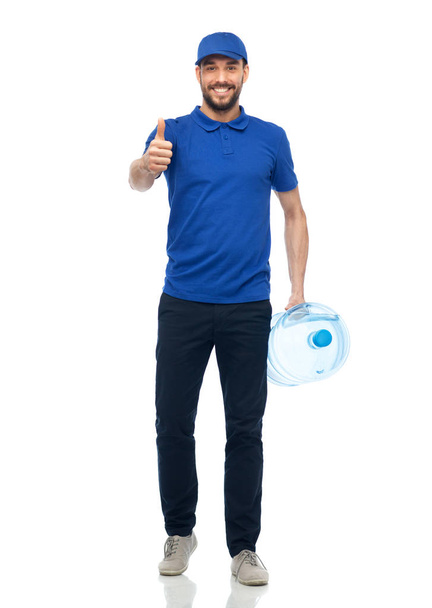happy delivery man with bottle of water - Φωτογραφία, εικόνα