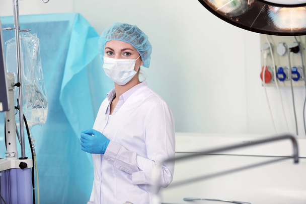 Young doctor in operating room of modern clinic - Foto, Imagem