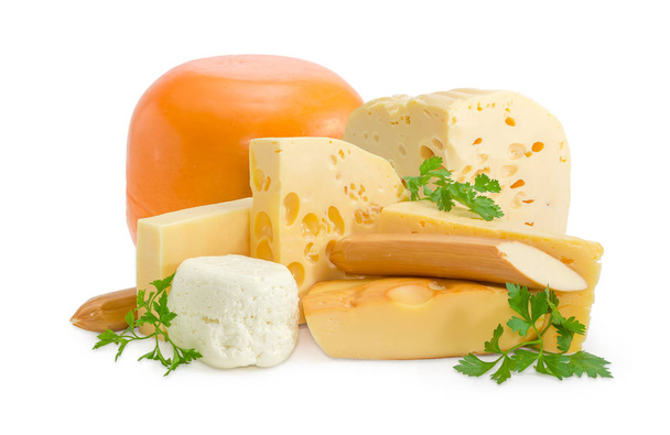 Several various types of cheese and twigs of parsley - Photo, Image