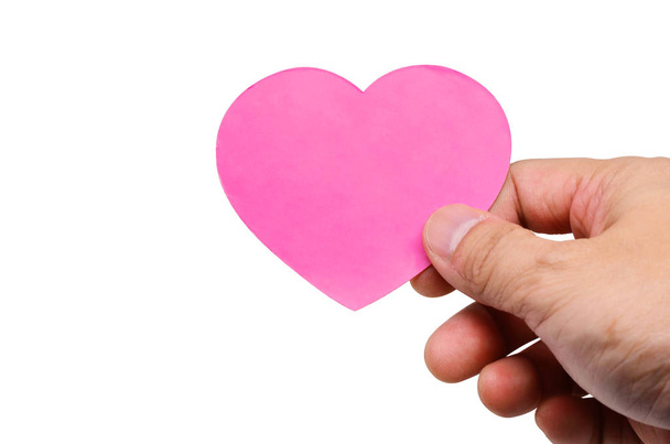 Hand met een label harten valentines day op wit - Foto, afbeelding