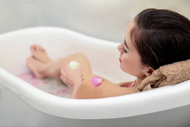 woman taking relaxing bath - 写真・画像