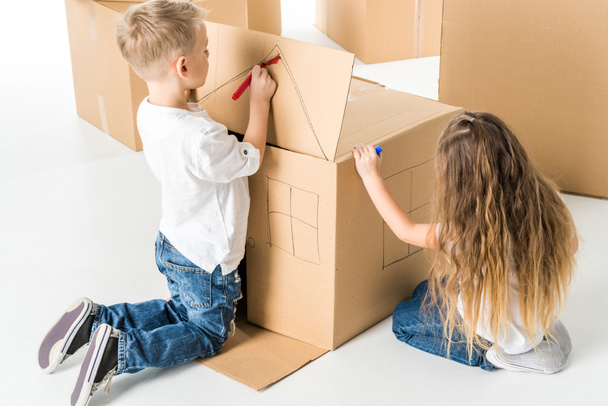 Kids drawing on cardboard box - Photo, Image