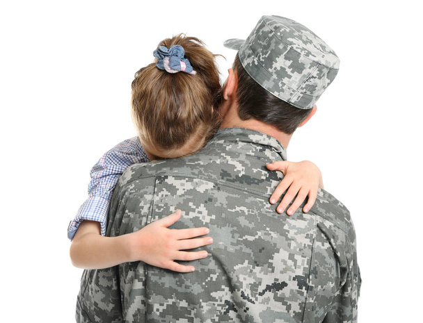 Soldier in camouflage hugging his daughter on white background - Fotó, kép