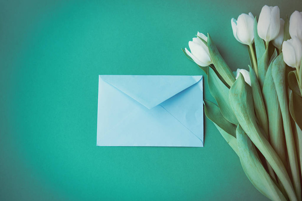 White tulips bouquet and envelope  - Photo, Image