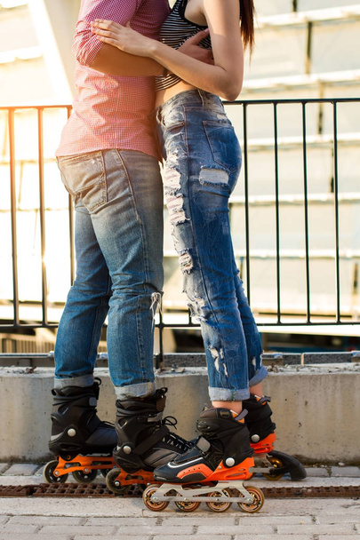 Couples legs on rollerblades. - Фото, изображение