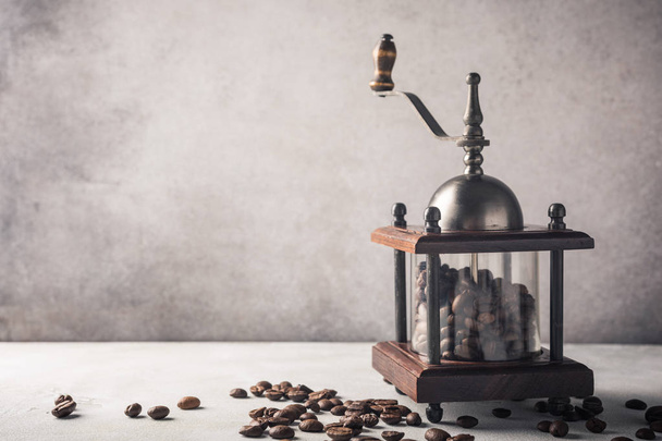 Retro coffee mill with beans - Фото, зображення