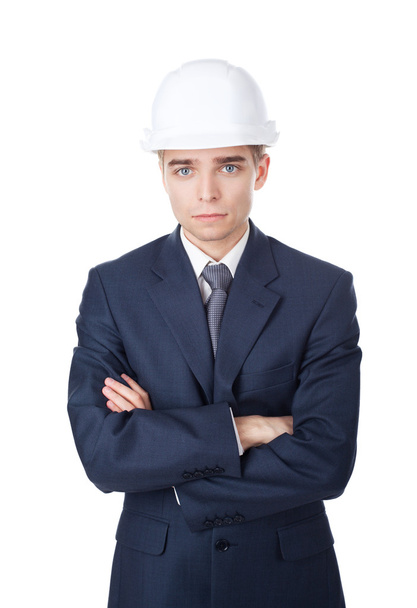 Engineer with white hard hat standing confidently isolated on wh - Foto, imagen