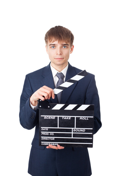young smiling businessman with clapperboard isolated on white ba - Foto, imagen