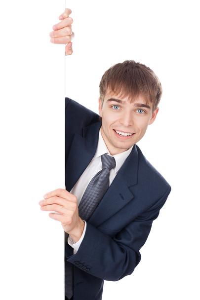 young smiling businessman holding white blank board isolated on - Fotografie, Obrázek