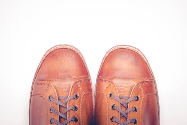 man leather brown shoes on white background. - Φωτογραφία, εικόνα