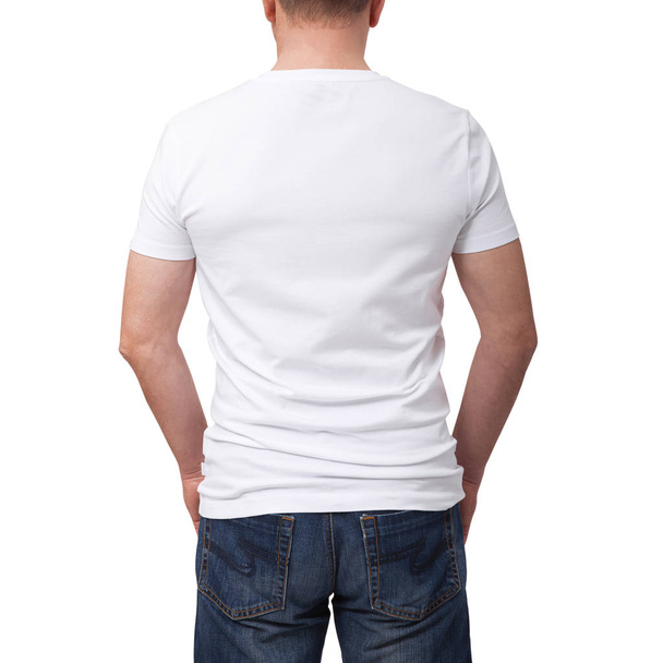 Man wearing blank t-shirt on gray brick wall background with copy space. Tshirt design and people concept - close up of man in blank white t-shirt. Back view - Zdjęcie, obraz