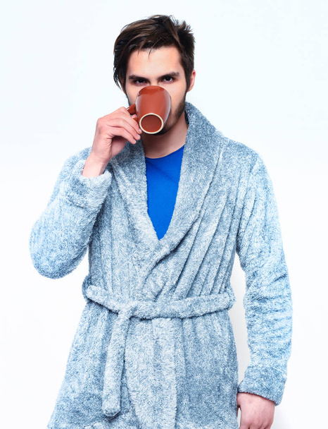 handsome bearded man with cup in terry bathrobe - Zdjęcie, obraz