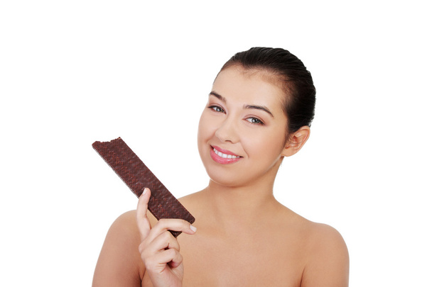 Pretty happy smiling woman eating chocolate waffle - Photo, Image