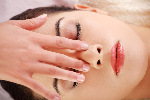 Woman enjoy receiving face massage at spa saloon - Fotografie, Obrázek