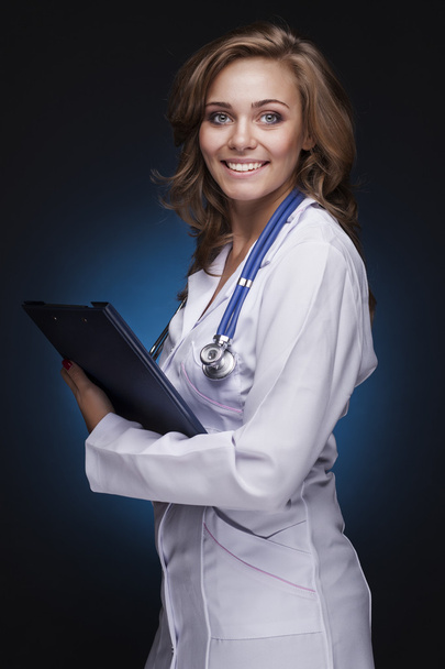 Young doctor woman with stethoscope - 写真・画像