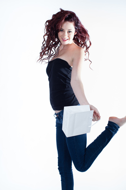Happy Pretty young woman with gift bag - Foto, imagen