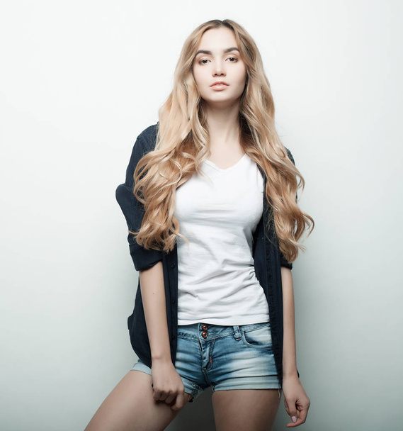 lifestyle, fashion and people concept: beautiful woman wearing casual clothes, posing on white background - Zdjęcie, obraz