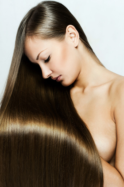 Closeup portrait of a beautiful young woman with long hair - Valokuva, kuva