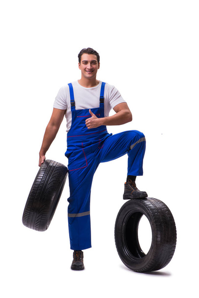 Handsome tyre repairman isolated on white - Zdjęcie, obraz
