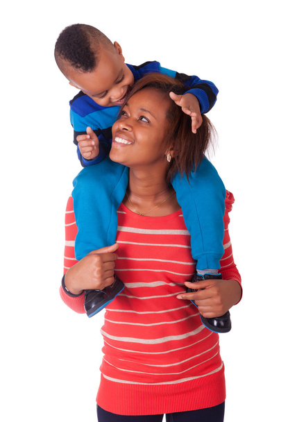 Happy child smiled on the shoulders of her mother - Foto, Imagem