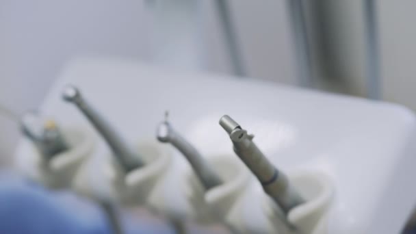 Dentists hands take the medical tools at dental clinic. Close-up. Concept of healthy life - Metraje, vídeo