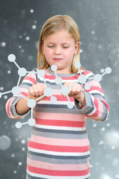 little girl holding chemical sign form - Φωτογραφία, εικόνα
