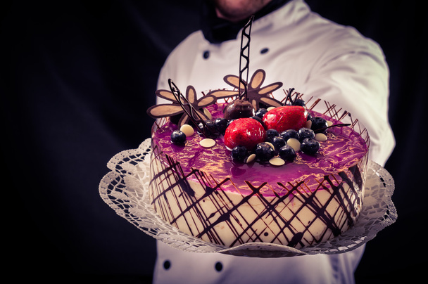 Confectioner and a cake - Foto, imagen