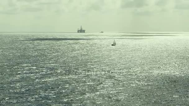 Silhouette Of An Oil Rig Drilling Platform and ships. Atlantic ocean. Noon. - Footage, Video