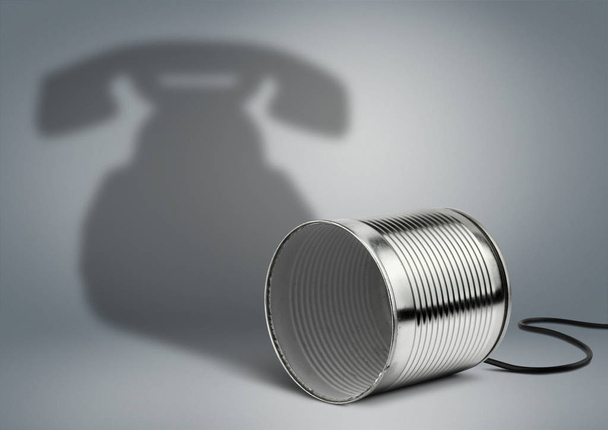 Tin can with telephone shadow, communication creative concept - Photo, image