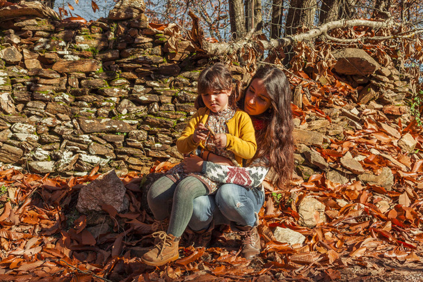 Portrait woman and girl admiring and enjoying nature. Autumn lan - Фото, изображение