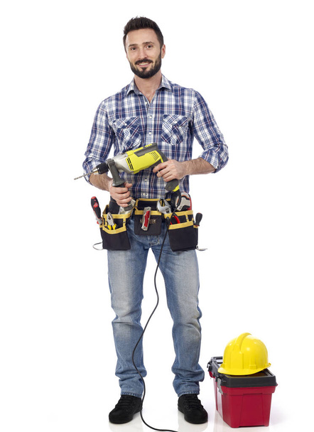 Carpenter with power drill and toolbox - Foto, Imagen