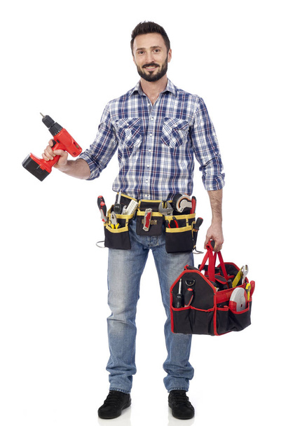 Carpenter with toolbox and drill - Photo, Image