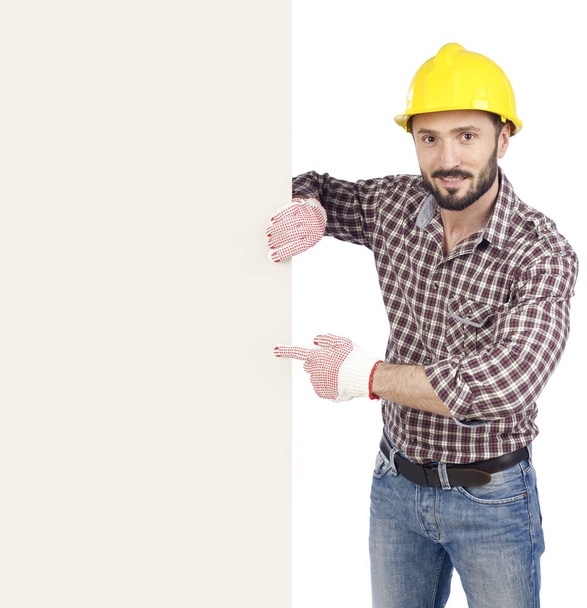Carpenter pointing at blank board - Photo, Image
