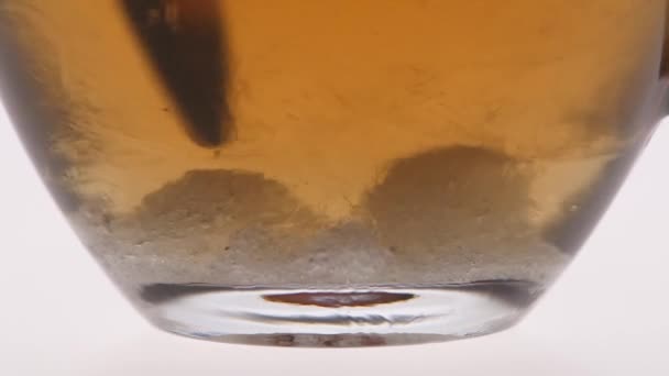 Undissolved sugar at the bottom the stir of spoon - Video