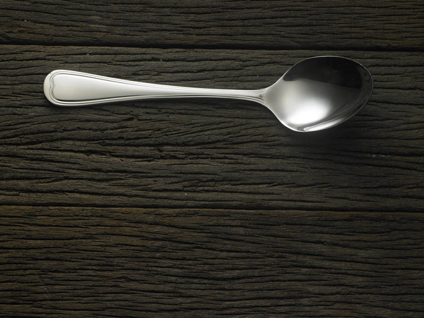 spoon on wooden table - Foto, imagen