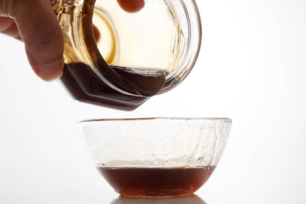 pouring wild honey - Valokuva, kuva