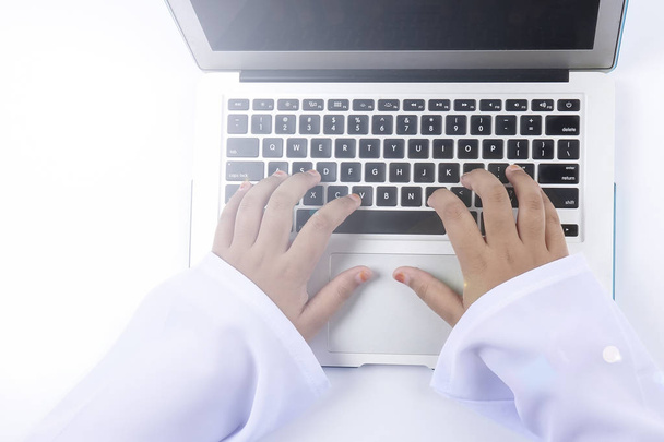 Student's hand typing on laptop keyboard. - Foto, Bild