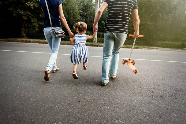 parents holding hands with daughter  - Photo, Image