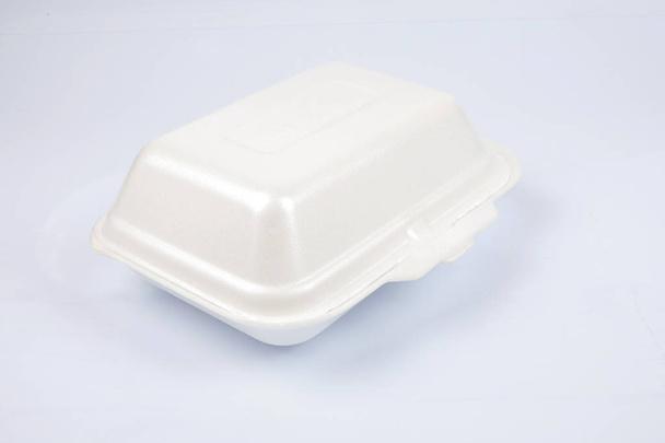 unhealthy polystyrene lunch boxes with take away meal isolated on white background. - Fotó, kép