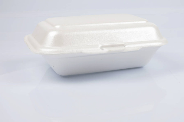 unhealthy polystyrene lunch boxes with take away meal isolated on white background. - Valokuva, kuva