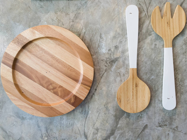 Top view of wooden plate fork spoon - Photo, Image