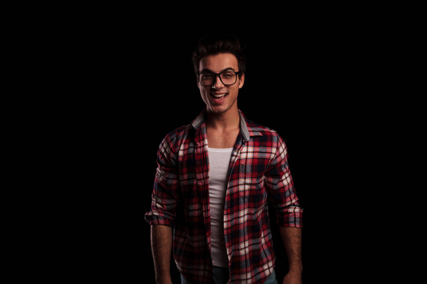 laughing young sexy man in checkered shirt and jeans  - Photo, Image