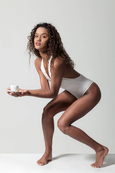 Beautiful girl with a cup of coffee - Фото, зображення