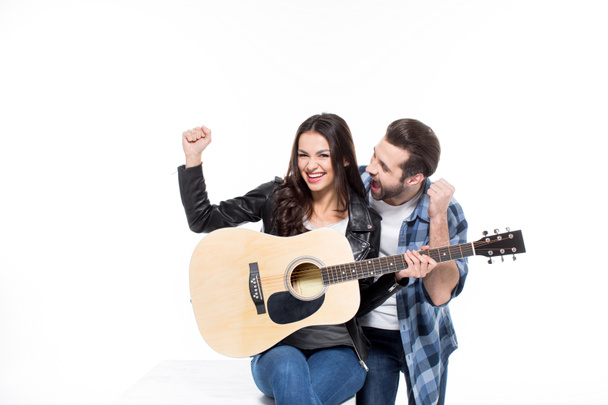Young couple with guitar - Fotó, kép