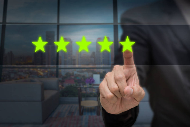 Businessman pointing five star  - Photo, Image